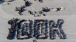 100K Sign Formed By Students