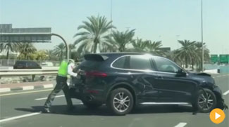 WATCH: Dubai Policeman Pushes Crashed Car Out Of The Way