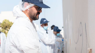 Volunteers Join Dubai Municipality To Repaint Graffiti-Affected Walls